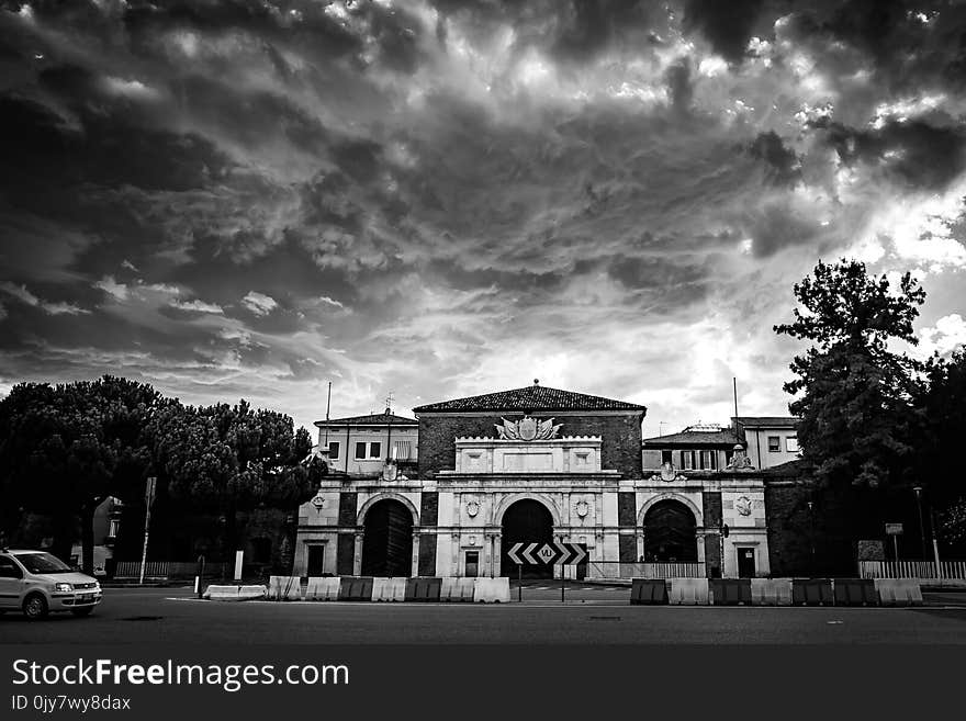 Grayscale Photo of Concrete Mansion