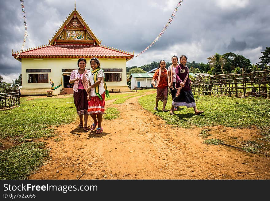 Five Women Walking on Green Grasses