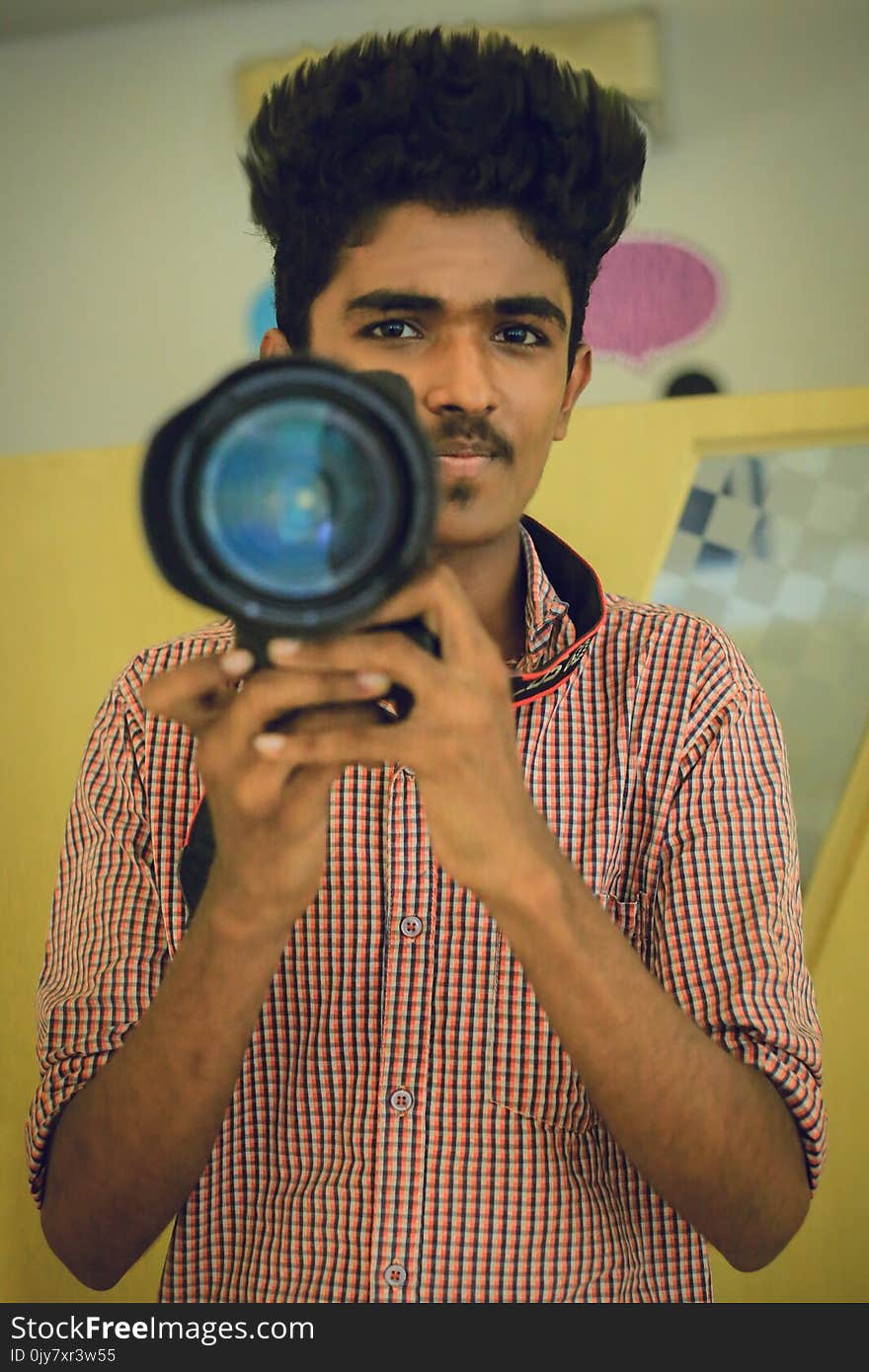 Man Holding Dslr Camera