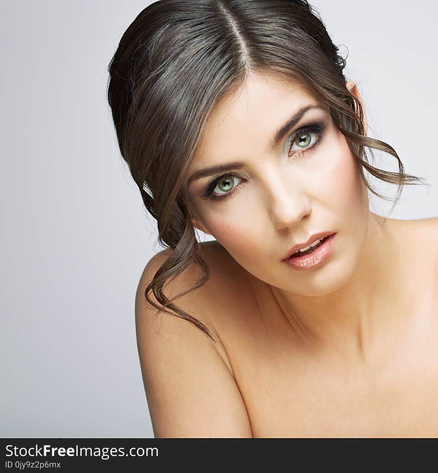 Beautiful woman portrait . Nude shoulders. Female model studio posing.