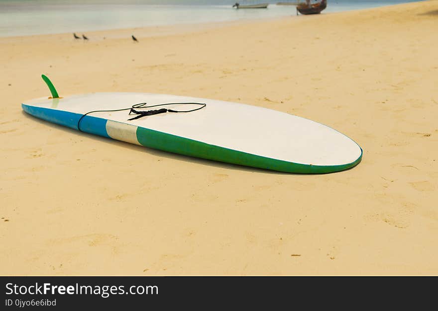 Surfboard in the sand beach Summer background