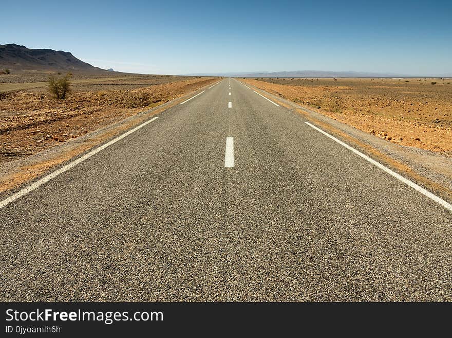 Asphalt road in a rocky desert