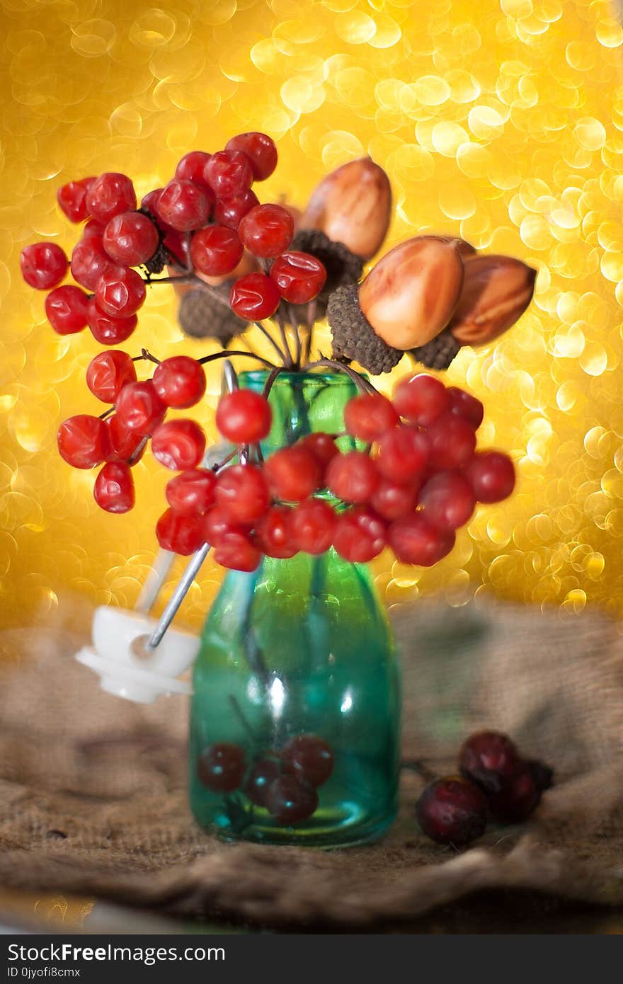 Red ripe bunches of viburnum hanging on the rope for sale at Ukrainian market. Viburnum kalina red berries close up.