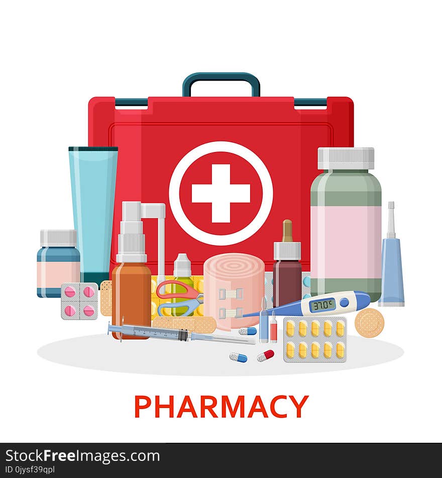 Pharmacy background. Medical first aid kit with different pills, plaster, bottles and thermometer, syringe