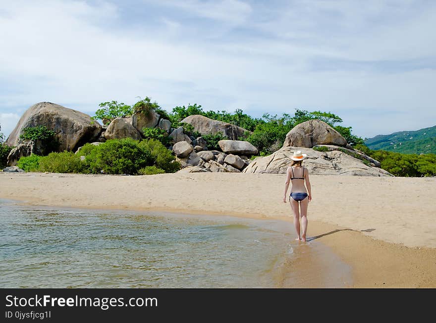 Blonde In A Bikini On A Paradise Beach.