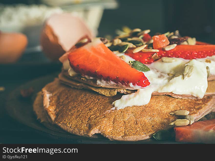 Strawberry pancakes. Close-up of a pancake with strawberries and cream. Strawberry pancakes. Close-up of a pancake with strawberries and cream