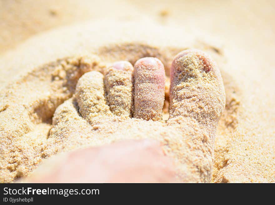 Foot In The Sand On The Beach