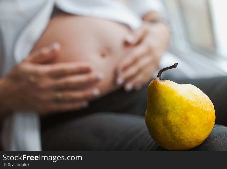 Pregnant woman choosing healthy food.