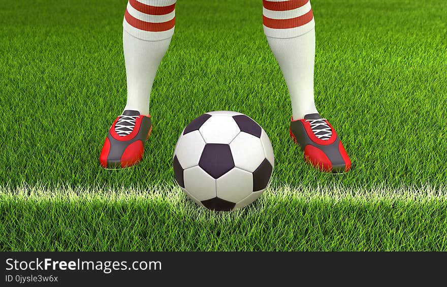 Man with a soccer ball on grass