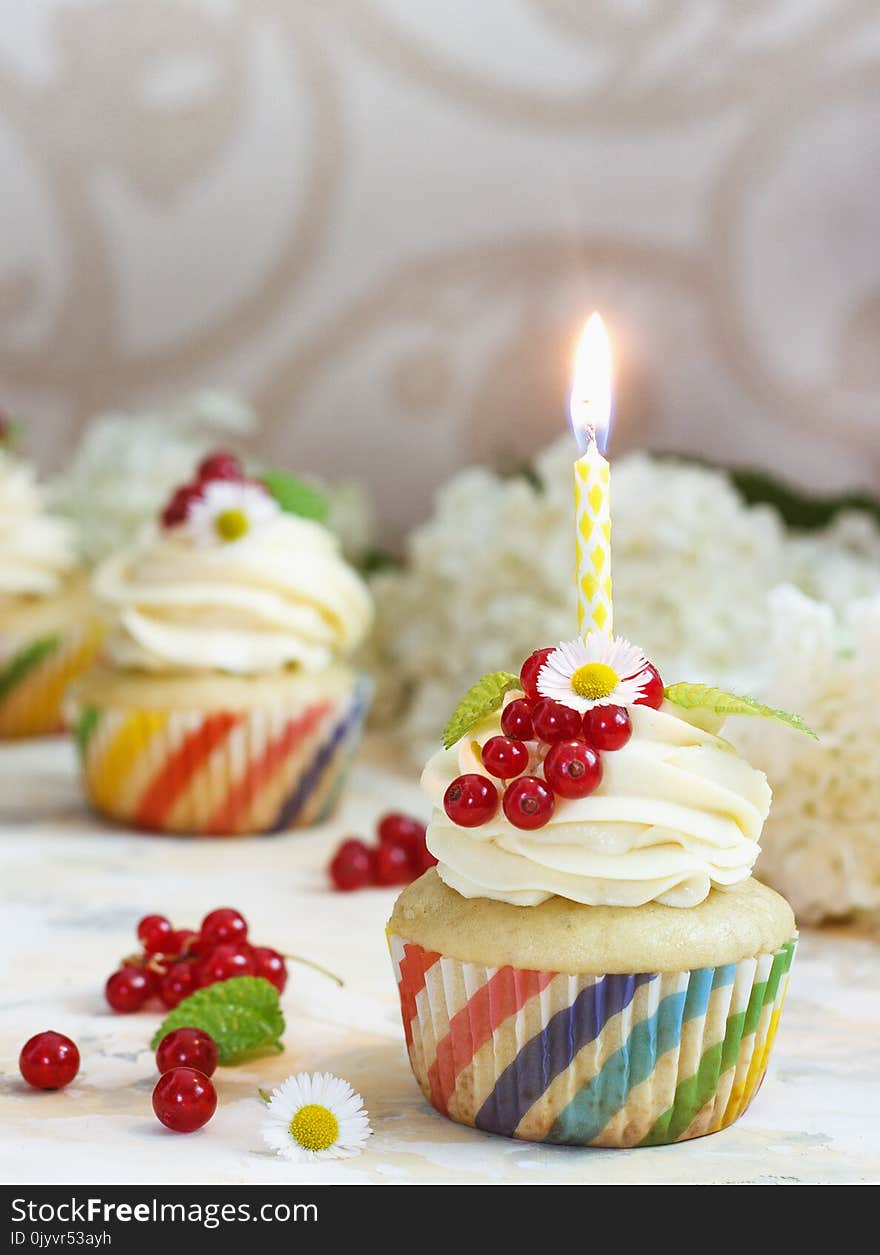 Gentle Cupcake With Cream And Berries Nd A Candle A Light Background