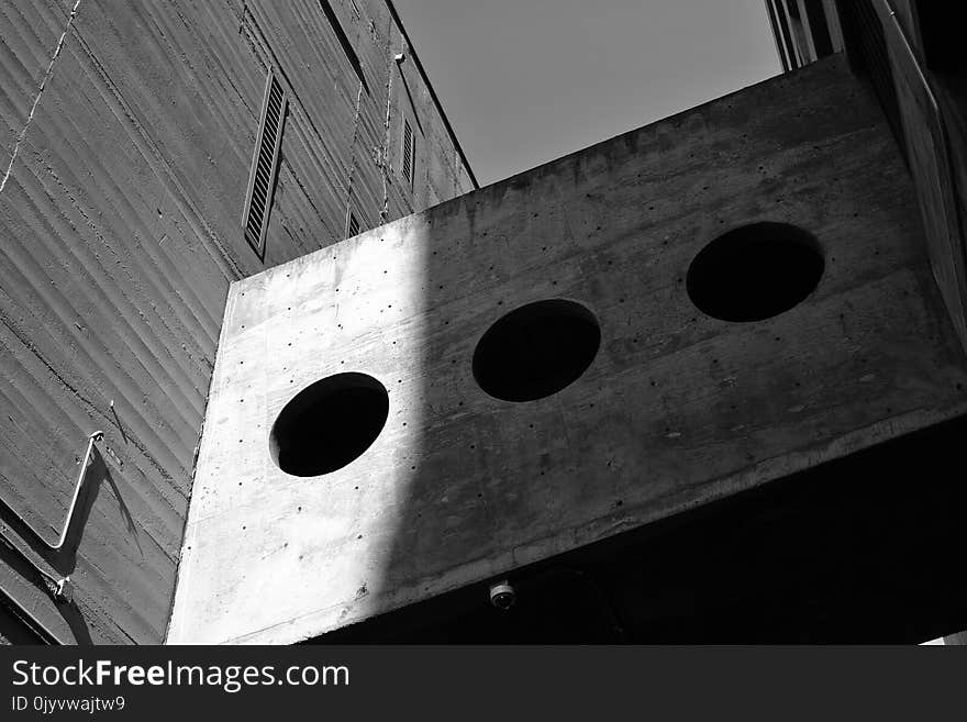 Grayscale Photography of Board With Three Round Holes