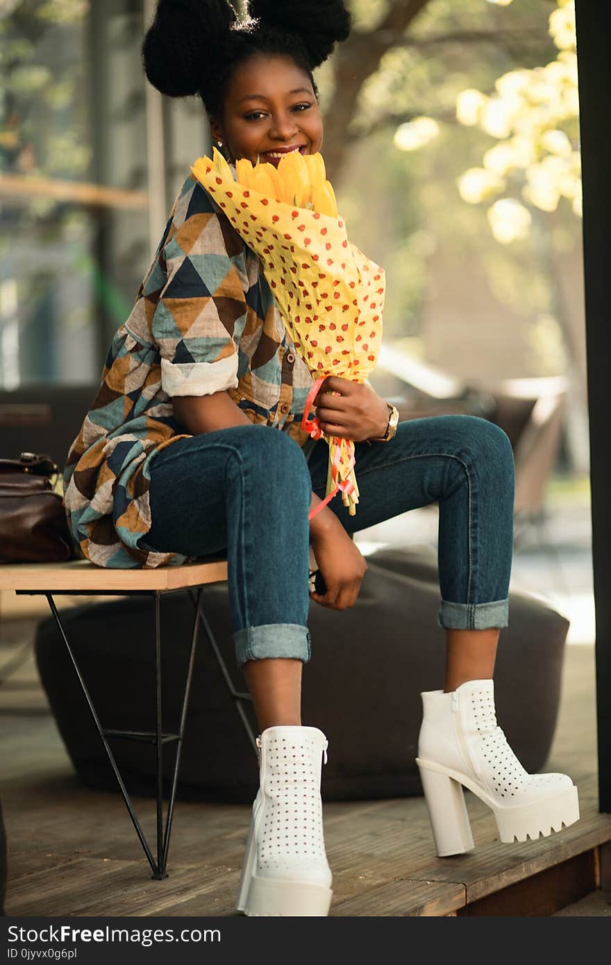 Woman in Brown and Blue Quarter-sleeved Dress Sitting on Chair