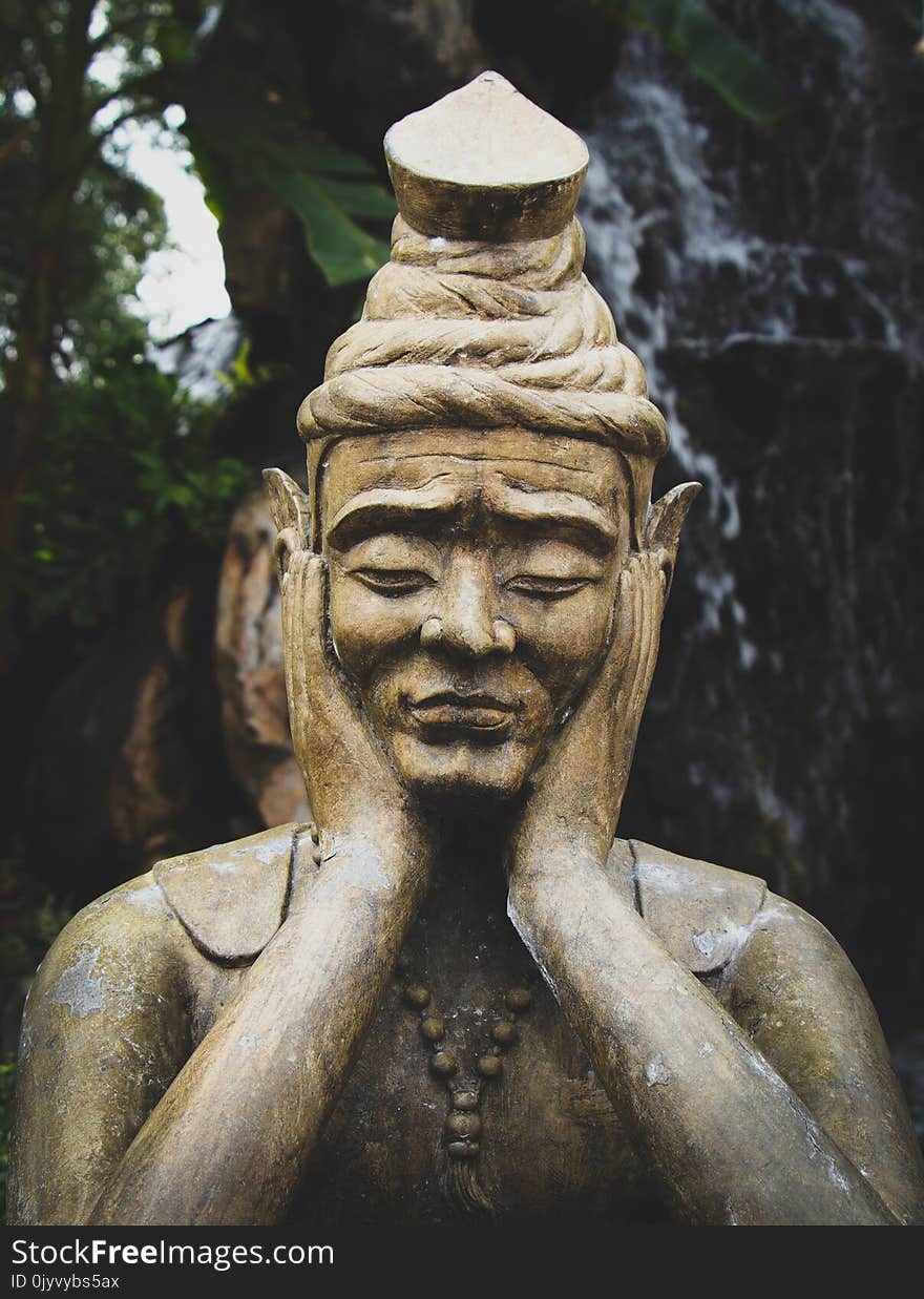 Selective Focus Photo of Buddha Statue