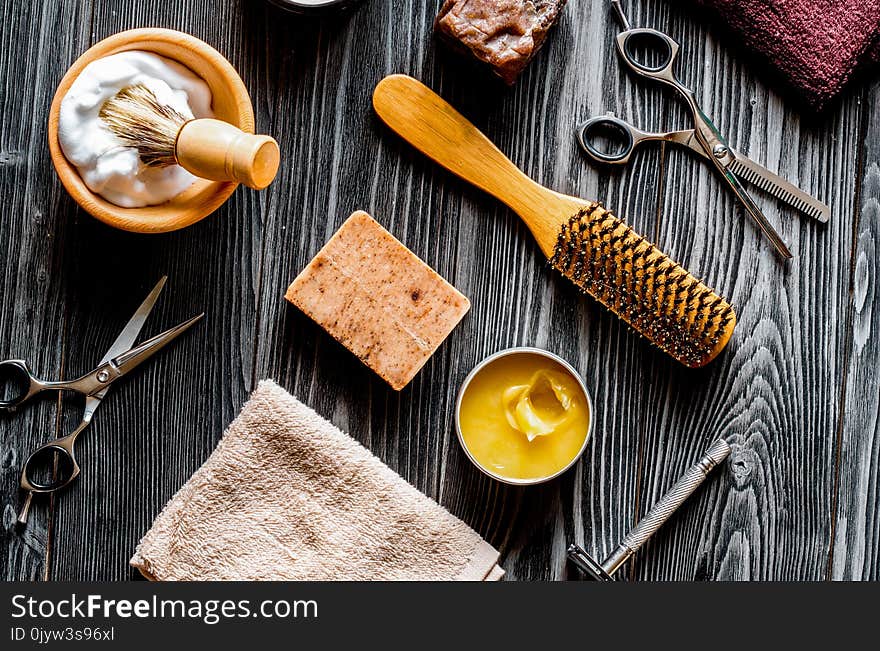 Tools for cutting beard barbershop top view on dark wooden background