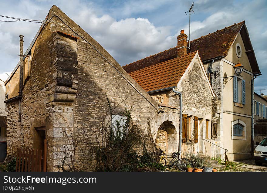 Old Medieval Houses On The Cobbled Street In Ancient French Village Noyers