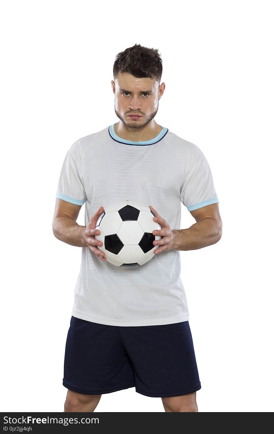 Young soccer player on grass with white shirt and ball in hands on white background