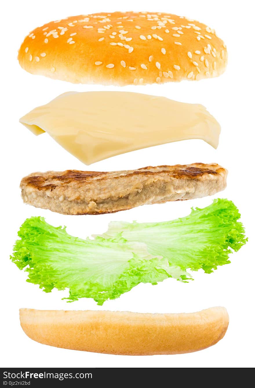 Delicious hamburger with flying ingredients on white background