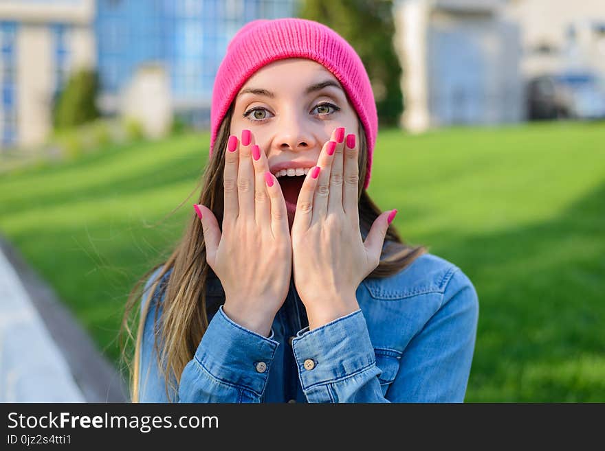 Happy Joyful Surprised Teenage Girl In Pink Hat, With Pink Nail