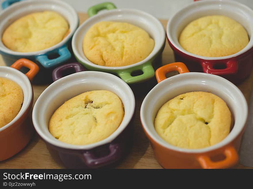 Cottage cheese casserole in colored ceramic forms in the form of pans. kid`s food