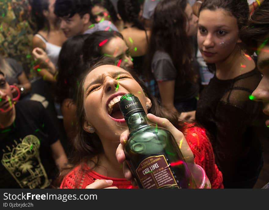 Woman Wearing Red Shirt Drinking