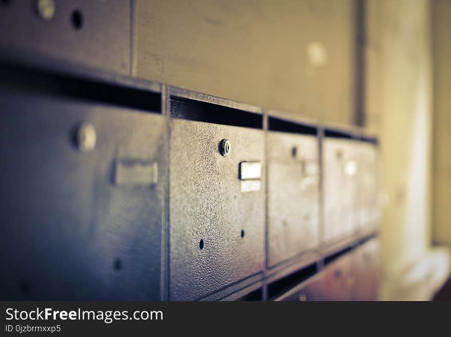 Selective Focus Photo of Black Wooden Drawers