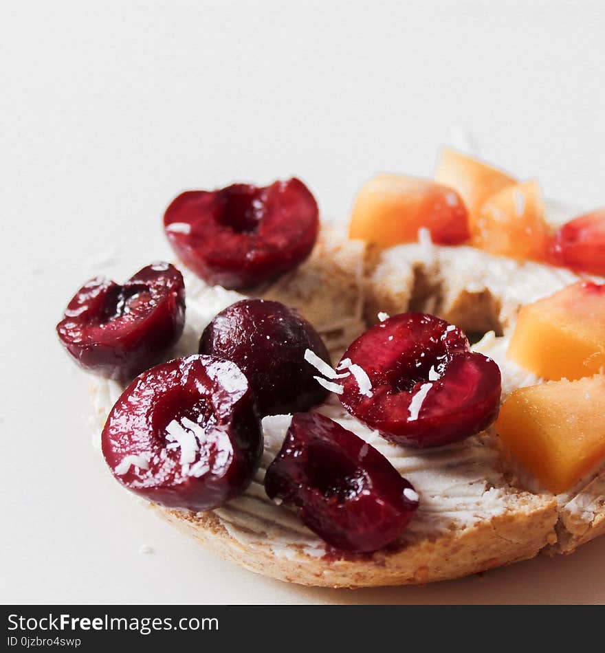 Depth of Field Photography of Cookie With Cherry Toppings