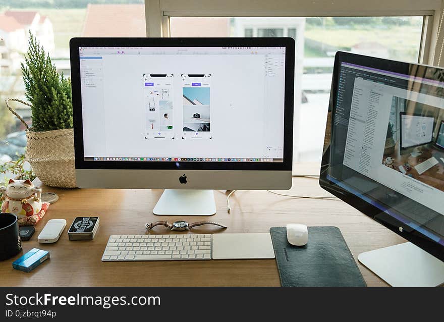 Apple Imac on Brown Wooden Desk