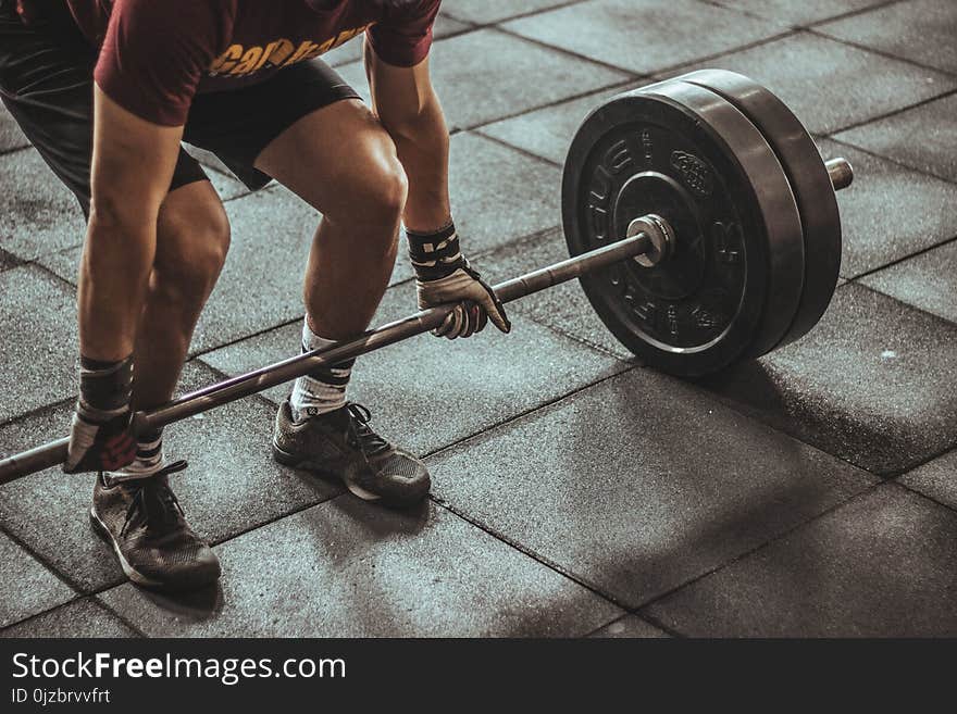 Person Holding Black and Silver Steel Barbell Photography