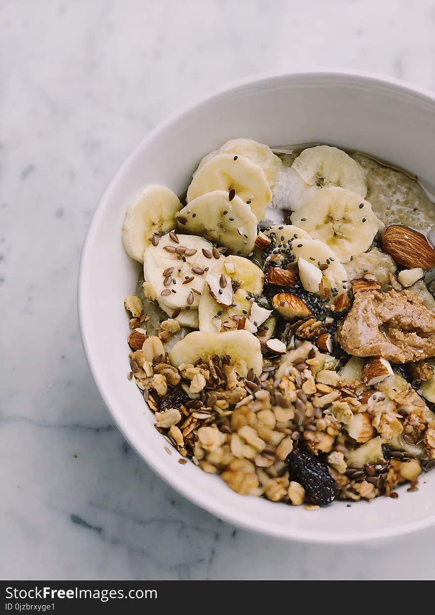 Cereal With Banana on White Bowl