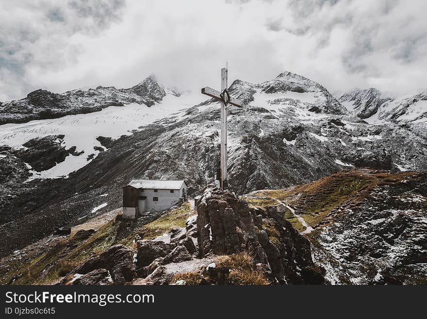 Landscape Photo of White Cross on Mountain