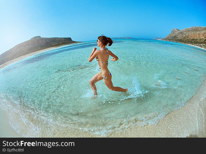 Woman running on the beach