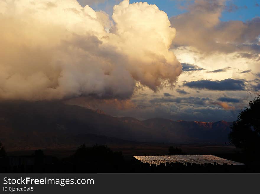 Storm clouds yellow and gray over the mountain