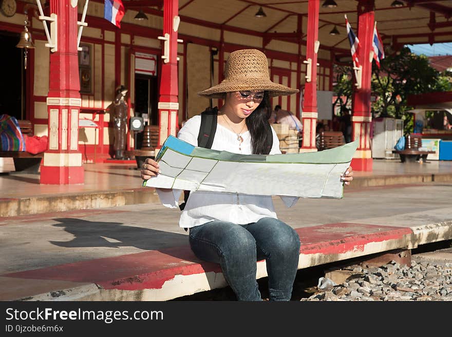 Pretty Asian Traveler Backpacker Female Looking Map At Railway Station.