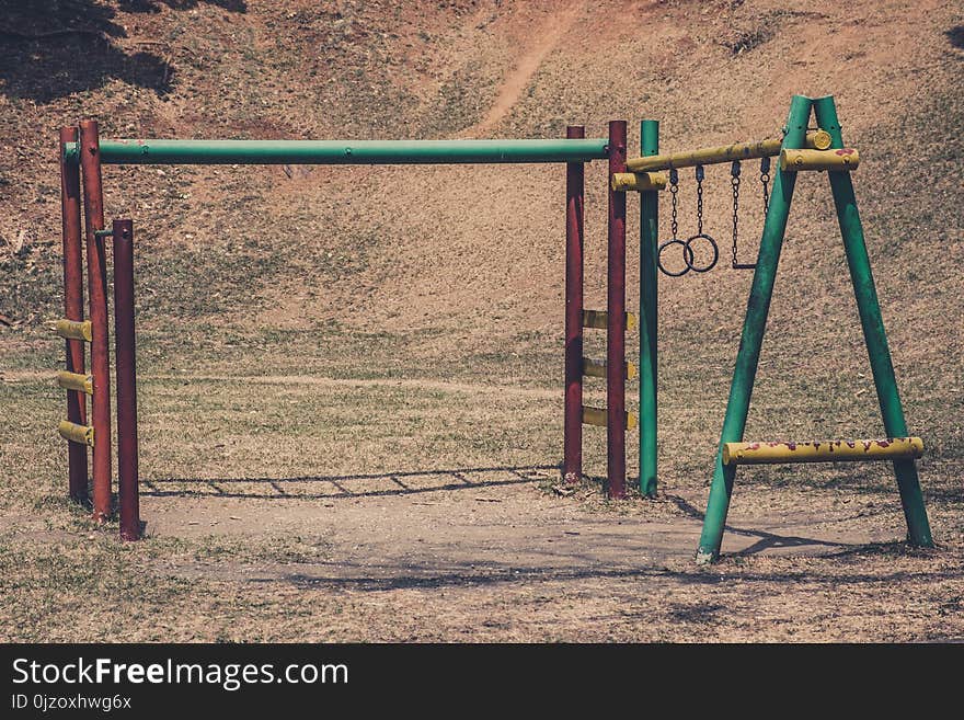 Old climbing frame on rusty old playground in outdoor park