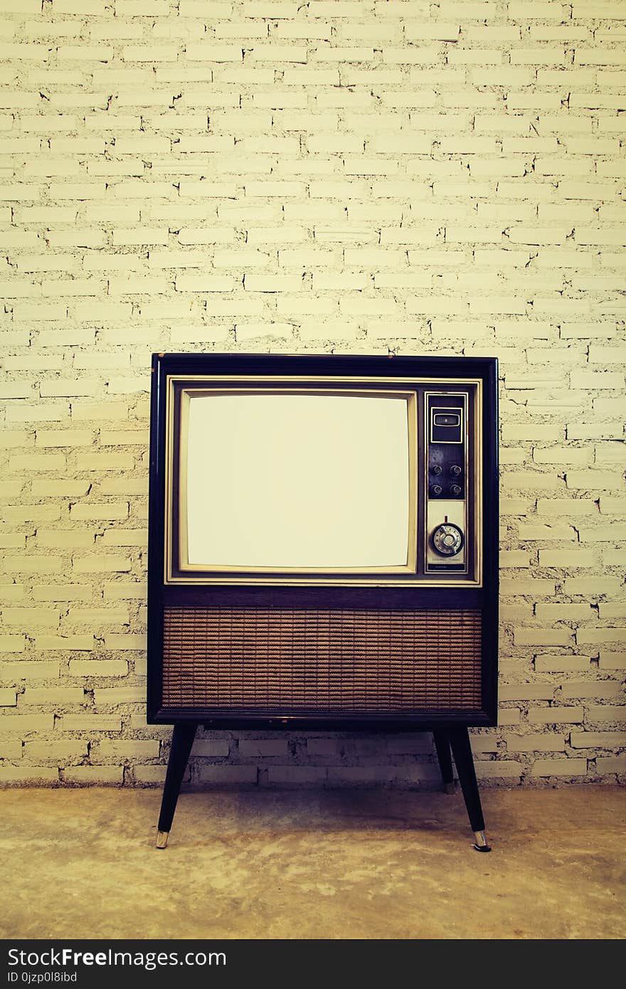 Retro tv with brick wall background Vintage