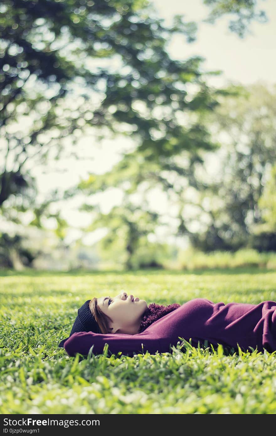 Beautiful young woman lying thinking something