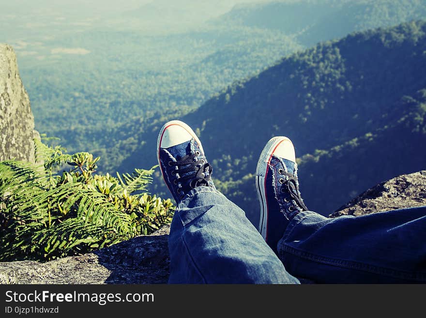 Man Laying Feet Top Of The Mountain