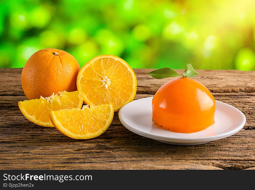 Orange cake on grunge wooden table