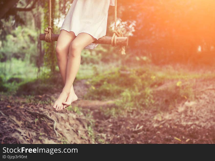 Beautiful Women Are Sitting Swings Very Happy.