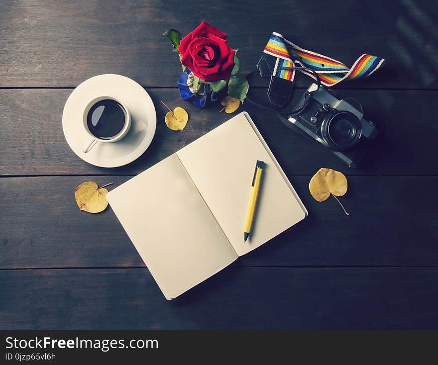 Top View Coffee And Cup And A Plate And A Blank Memory Book With