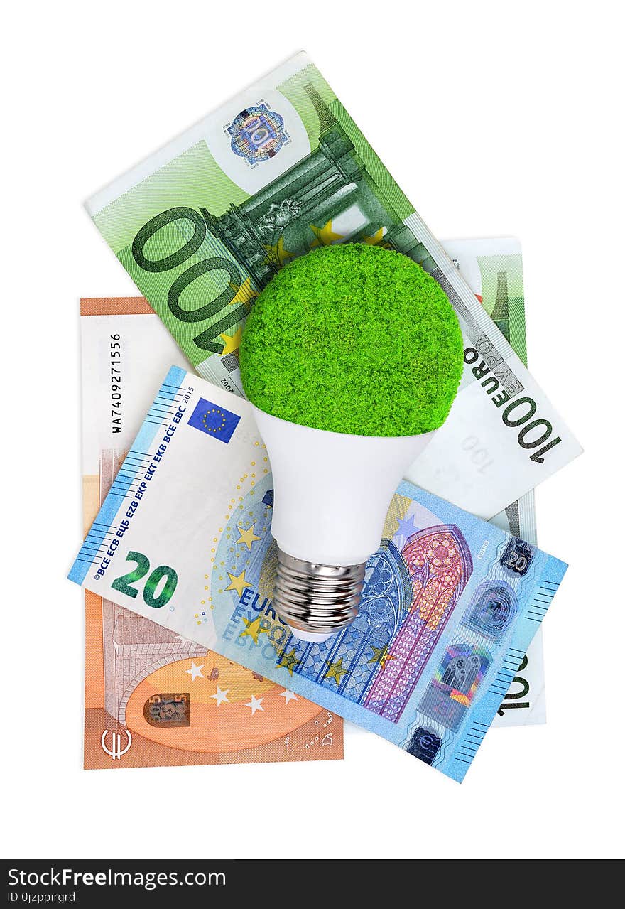 LED light bulb with euro banknotes isolated on a white background. Concept of saving money for energy.