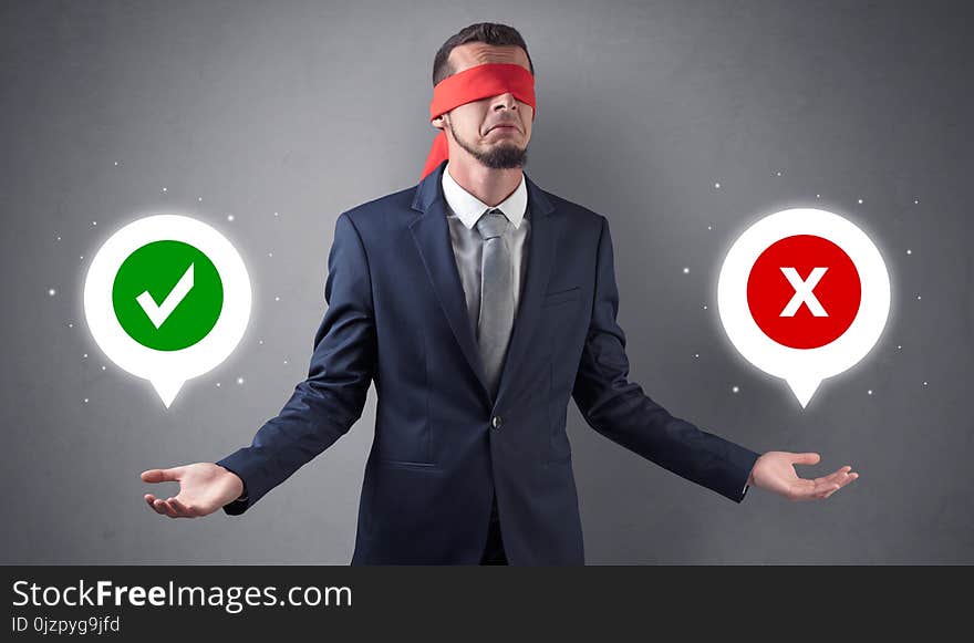 Blindfolded businessman trying to choose