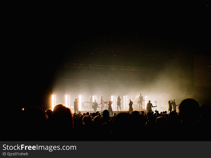 Silhouette Photo of Music Band Playing on Stage