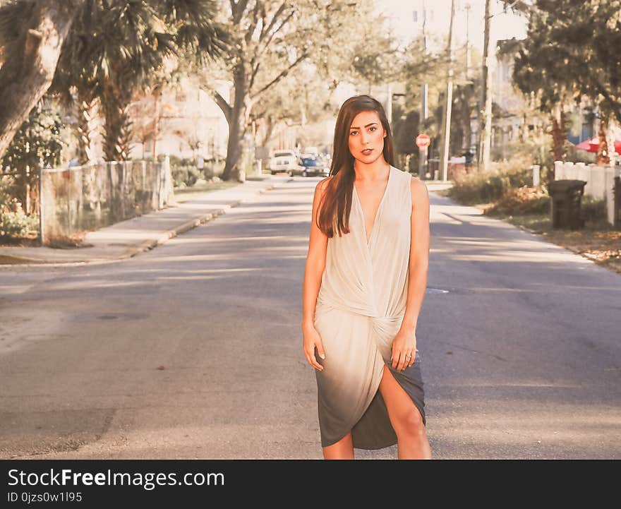 Woman in White and Black Ombre Sleeveless Dress