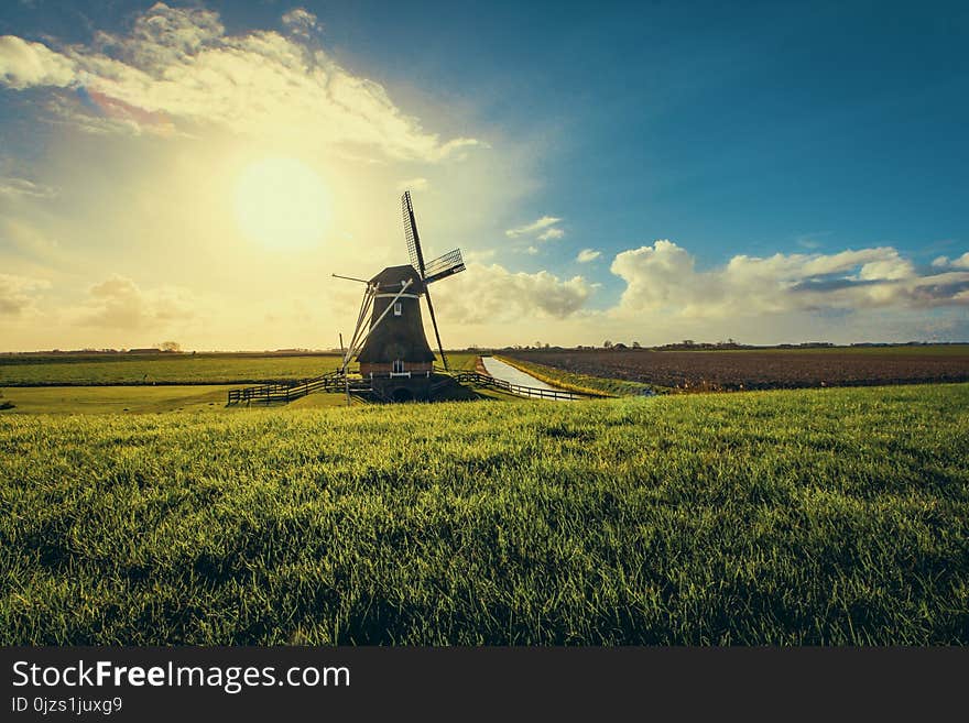 Vintage Black Windmill during Sunset