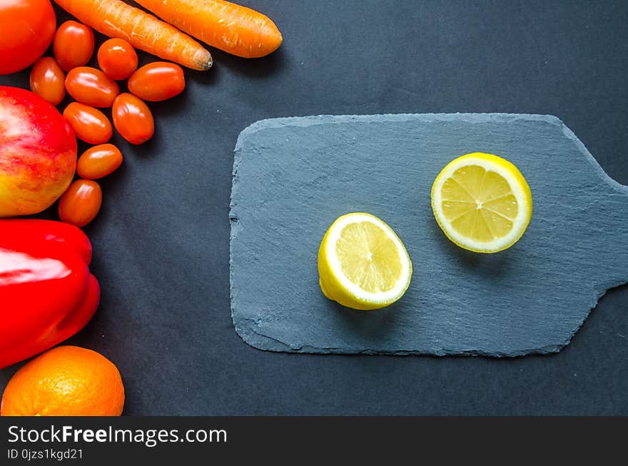 Sliced Lemon on Blue Chopping Board