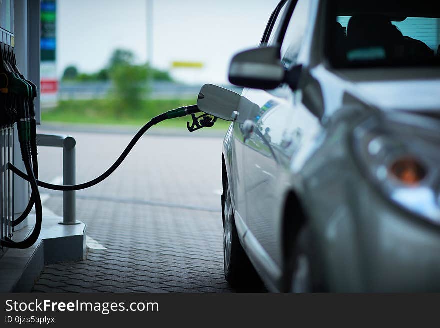 Car refueling on a petrol station. front view.