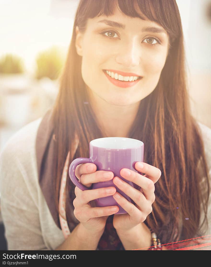 Modern Young Fashion Designer With Cup At Studio