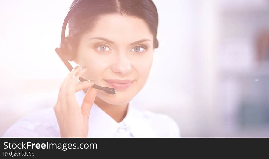 Close-up portrait of a customer service agent sitting at office