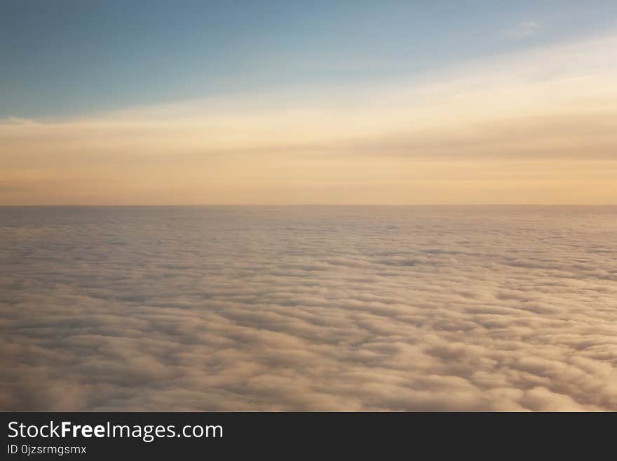 Sunset above the clouds with copy space